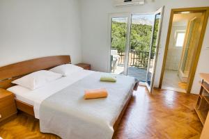 Postel nebo postele na pokoji v ubytování Villa Ivanka + 25 fotografií