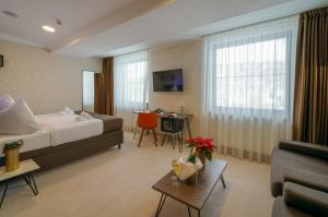 TV a/nebo společenská místnost v ubytování Grand Hotel BELLEVUE