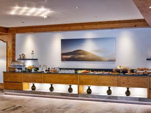 a buffet in a hotel room with food on display at Hotel Weis in Mertesdorf