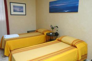 Mare Nostrum Petit Hôtel客房内的一张或多张床位