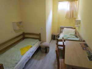 Ένα ή περισσότερα κρεβάτια σε δωμάτιο στο Arsego Hostel