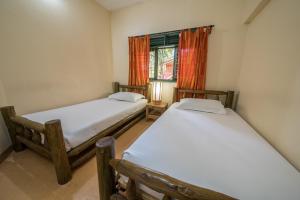 Кровать или кровати в номере Forest Cottages
