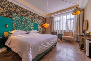 Cama o camas de una habitación en Jinjiang Metropolo Shanghai Xintiandi Hotel
