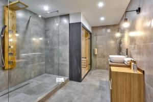 a bathroom with a shower and a sink at 77 - Urban Sublime Le Marais in Paris
