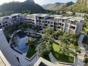 an aerial view of an apartment complex with a swimming pool at The Valley Khao Yai-2 Bed Room in Ban Huai Sok Noi
