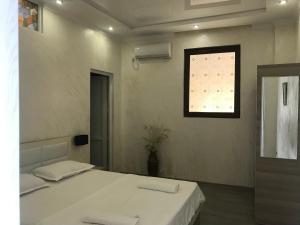 Ένα ή περισσότερα κρεβάτια σε δωμάτιο στο Hotel Chaika