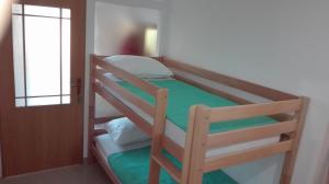 Posteľ alebo postele v izbe v ubytovaní Apartmani Dvosoban
