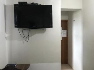 Televiisor ja/või meelelahutuskeskus majutusasutuses Hotel Sur Brasil