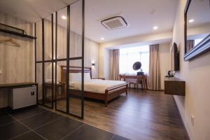 Postel nebo postele na pokoji v ubytování Wifi Boutique Hotel