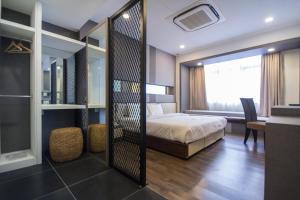Postel nebo postele na pokoji v ubytování Wifi Boutique Hotel