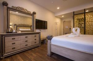 Postel nebo postele na pokoji v ubytování Wifi Boutique Hotel