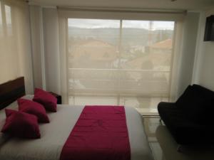 Postel nebo postele na pokoji v ubytování Hotel Campestre Villa Juliana