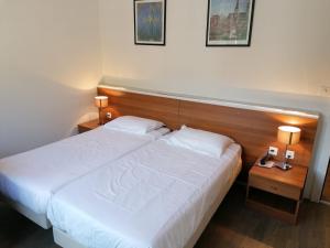 Katil atau katil-katil dalam bilik di Hotel Gamper