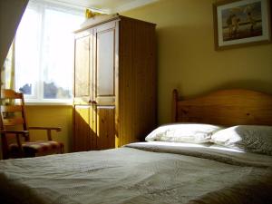Tempat tidur dalam kamar di Braedene Lodge