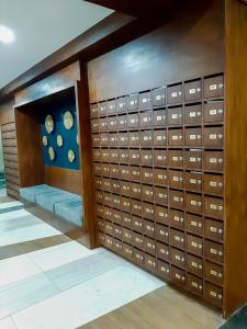 a room with a bunch of lockers in a building at ANIA ROOMS@AMANI GRAND RESIDENCES NEAR AIRPORT in Mactan