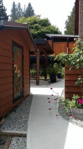 a building with a door with a painting on it at Nestledown B&B in Halfmoon Bay