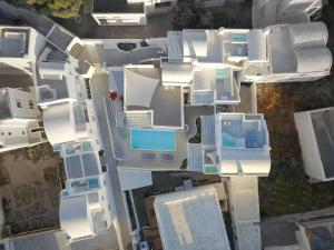 an aerial view of white buildings in a city at Palmariva Villas in Fira