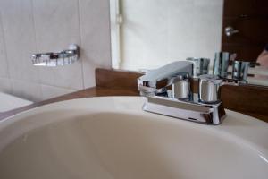 Koupelna v ubytování Madison Suites