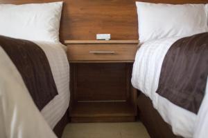 Postel nebo postele na pokoji v ubytování Madison Suites