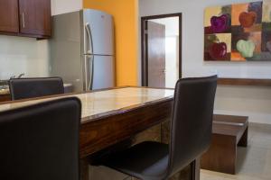 Kuchyň nebo kuchyňský kout v ubytování Madison Suites