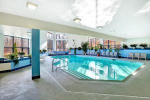 a large swimming pool in a large building at Ski on ski off, conveniently located, 2 bedroom condo with beautiful views, access to indoor pool Sunrise B3 in Killington