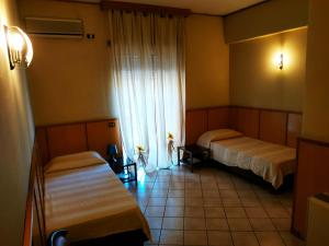 Posteľ alebo postele v izbe v ubytovaní Residence Hotel Valery
