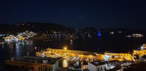 a harbor at night with boats in the water at Villa Ersilia in Ponza