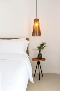 Postel nebo postele na pokoji v ubytování Obsession Mykonos