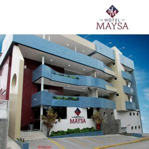 un hotel maysa edificio con un cartel delante en Hotel Maysa Caruaru, en Caruaru