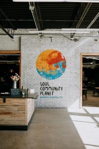 a brick wall with a sign on it at SCP Colorado Springs Hotel in Colorado Springs