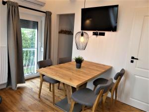 TV a/nebo společenská místnost v ubytování Storchennest-Appartements