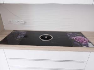 a kitchen counter with a stove top on top at Sasha bel appartement renove centre ville Beaune in Beaune