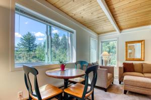 a living room with a table and chairs and a couch at Atelier 1015 in Sun Valley