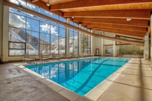a swimming pool with a view of a mountain at Pines 2041 in Keystone