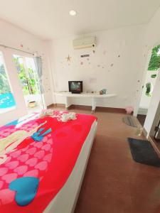 Ένα ή περισσότερα κρεβάτια σε δωμάτιο στο Rai Win Resort