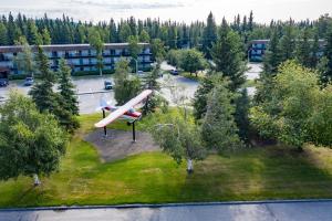 an airplane is sitting on a field in a park at Wedgewood Resort in Fairbanks
