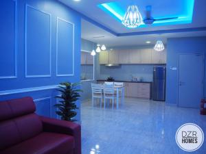 a living room and kitchen with a couch and a table at DZR Homes Bangi Wonderland near UKM Malay Only in Kajang
