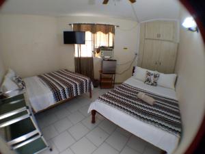Fotografie z fotogalerie ubytování The Red Hut Inn v destinaci Belize City
