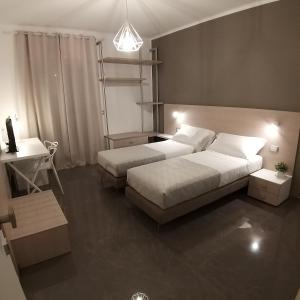 Ένα ή περισσότερα κρεβάτια σε δωμάτιο στο B&B La Rosa Felice