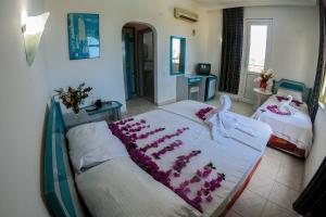 Postel nebo postele na pokoji v ubytování Marin Hotel