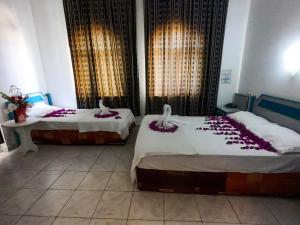 Postel nebo postele na pokoji v ubytování Marin Hotel