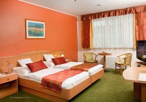 Posteľ alebo postele v izbe v ubytovaní Hotel Kálvária