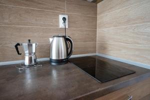 a coffee maker sitting on a counter in a kitchen at Tiffany Boutique Suits - Pomorie in Pomorie