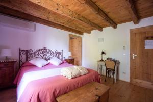 Ένα ή περισσότερα κρεβάτια σε δωμάτιο στο Regina nel cuore del Veneto