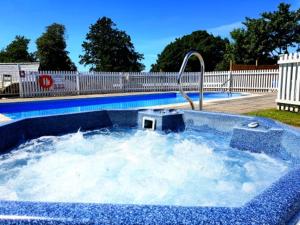 a pool of water with a swimming pool at Lincombe Hall Hotel & Spa - Just for Adults in Torquay