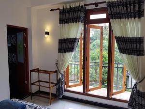 Postel nebo postele na pokoji v ubytování Kelum Homestay