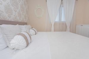 Posteľ alebo postele v izbe v ubytovaní Apartman Slavice