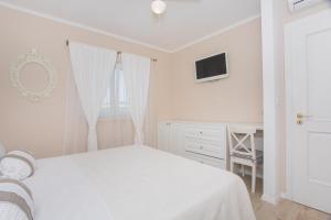 Posteľ alebo postele v izbe v ubytovaní Apartman Slavice
