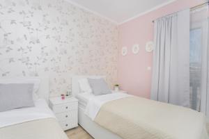 Posteľ alebo postele v izbe v ubytovaní Apartman Slavice