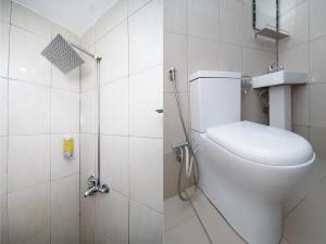 a bathroom with a toilet and a shower at OYO 89301 Ys Inn in Miri